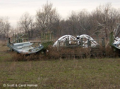 Coasters from Opryland USA in Nashville, Tennessee in storage at Old Indiana Fun Park in Thorntown, Indiana.  Both of these rides were eventually scrapped.
