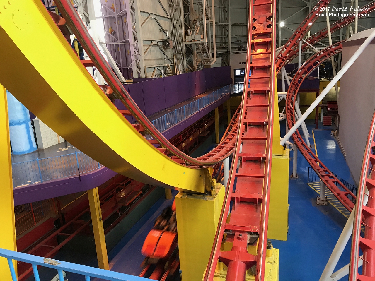Closer look at one of the vertical loops as a train rushes by.