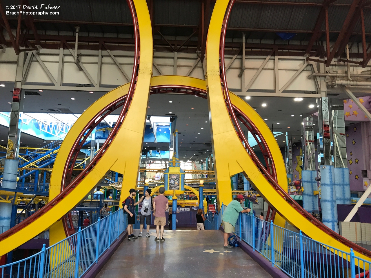 Vertical Loops with a walkway going through the third loop.