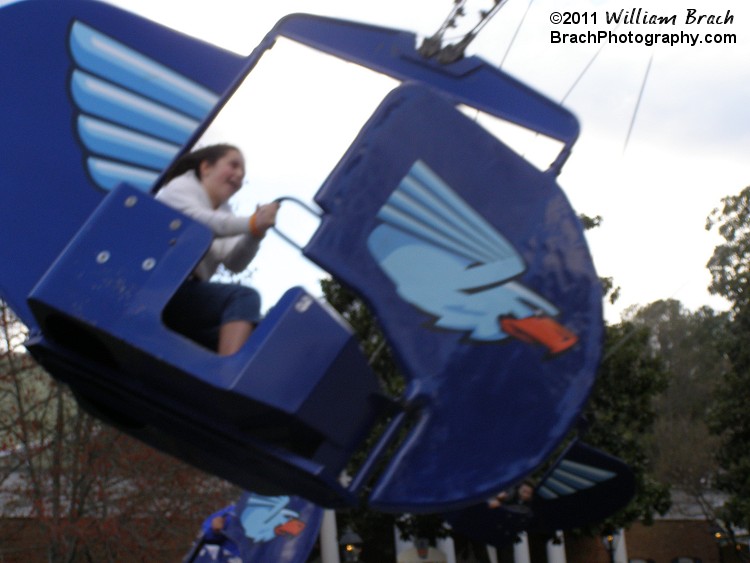 Great expression that girl's face!  She's having a fun time catching air on her boat.
