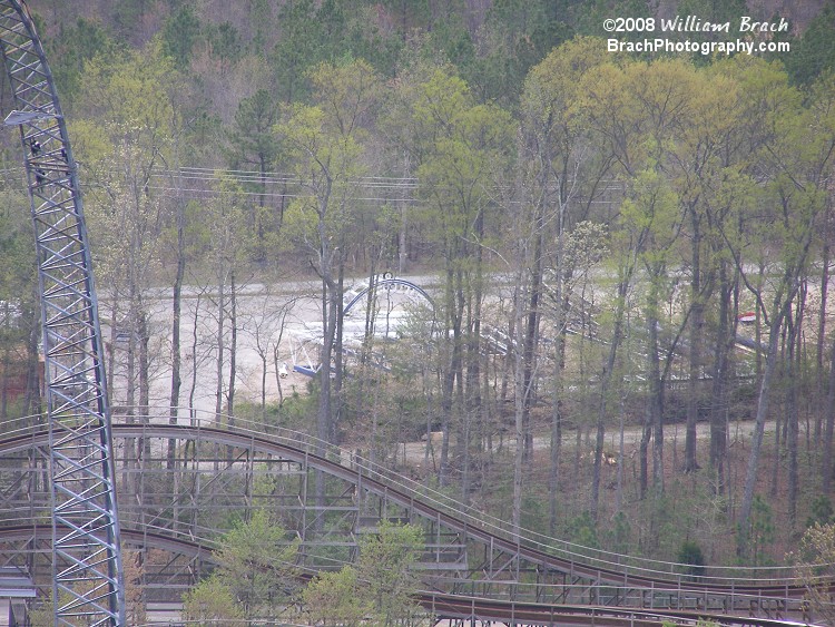 Probably the easiest thing to make out in this photo would be the crest of the top hat hill seen in storage in the park's boneyard just beyond Hurler.  As of the 2010 season, those track pieces were long gone.