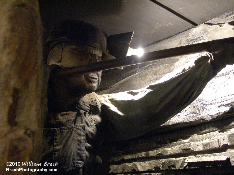Here we see a manequin of a guy digging up coal.