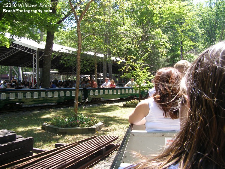 Departing the station as another train comes back to the station.