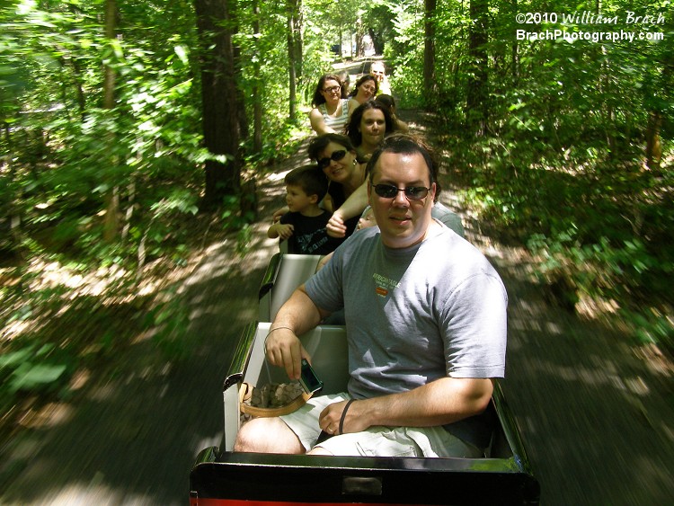 Guests enjoying the breeze while riding the train ride.