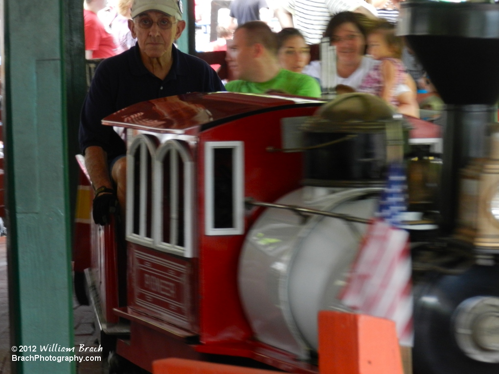 Red train arriving in the station.