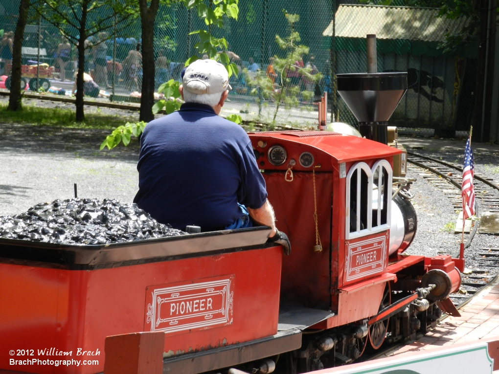 Red train pulling into the station.