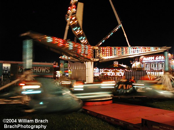 A futuristic take on the traditional scrambler ride.  More lights, neo-futuristic cars.