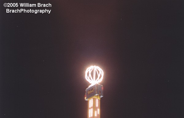 The top of the Spring ride all lit up at night.